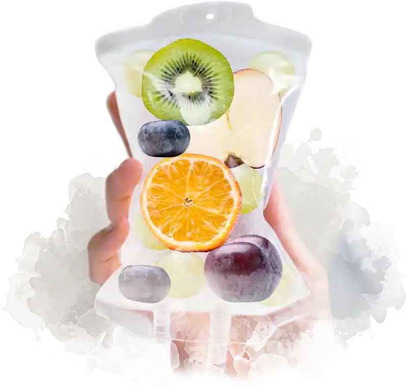 Hand holding a vitamin IV bag filled with fruit slices including orange, kiwi, grapes, apple, and plum, symbolizing hydration and vitamin IV drips and other wellness therapies at Infinite You Wellness Clinic in White Plains, NY.